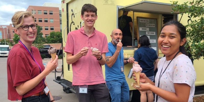 Postdocs enjoying ice cream at the ice cream truck event. 