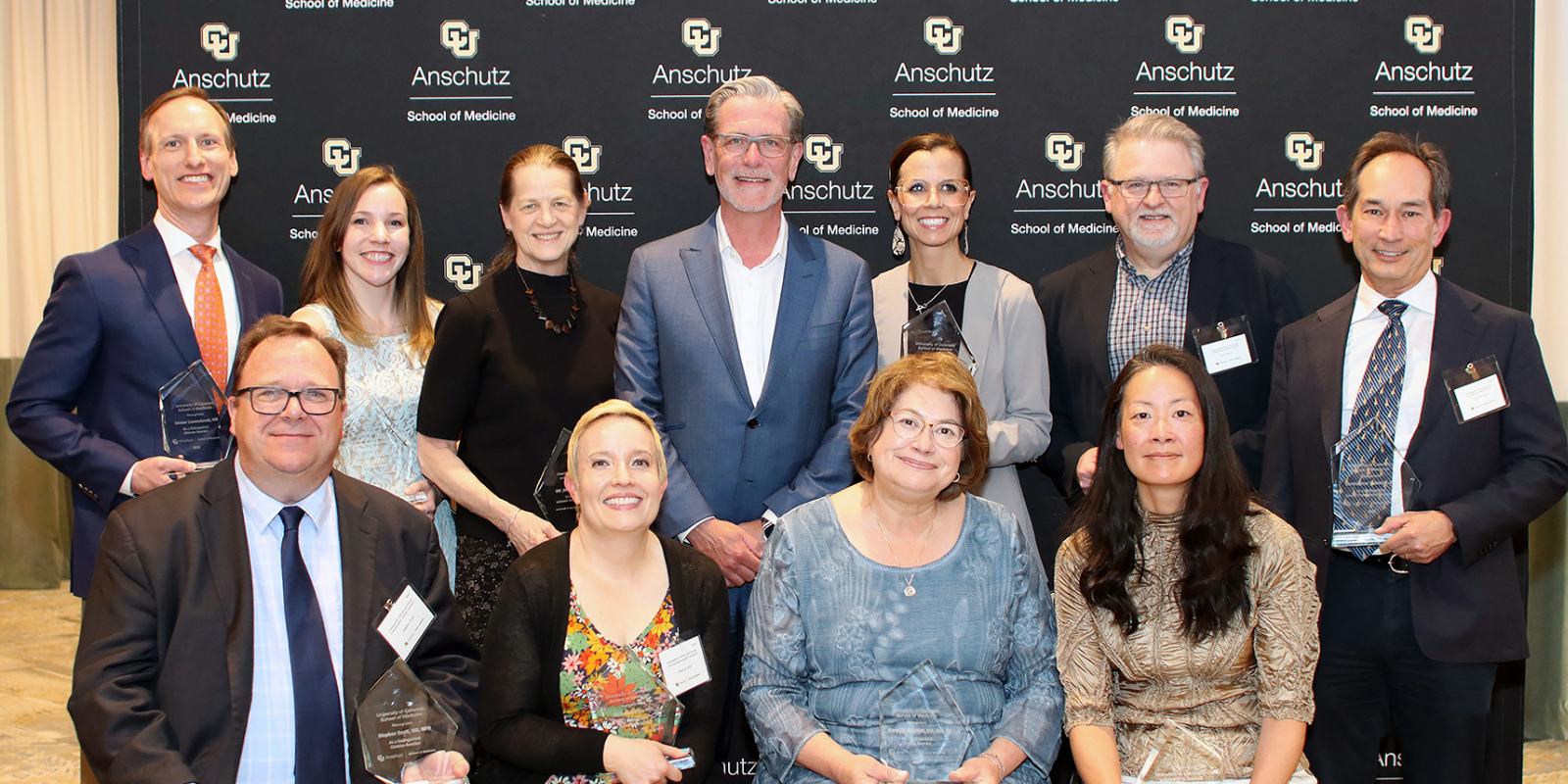 Recipients of the CU Anschutz School of Medicine Distinguished Faculty Professionalism Awards pose with Dean John Sampson, MD, PhD, MBA.