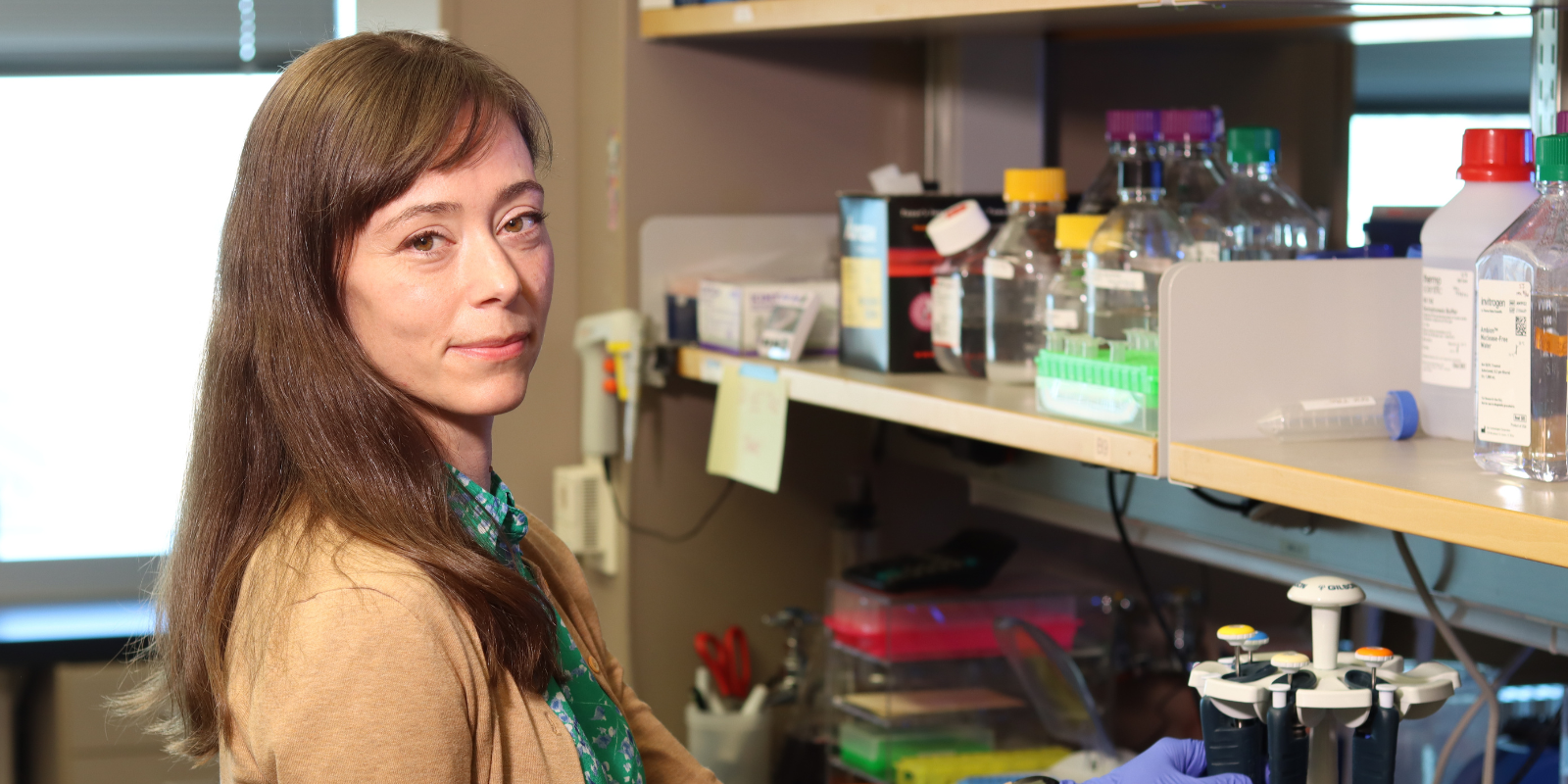 Image of Olivia Rissland standing in laboratory | University of Colorado Anschutz School of Medicine 