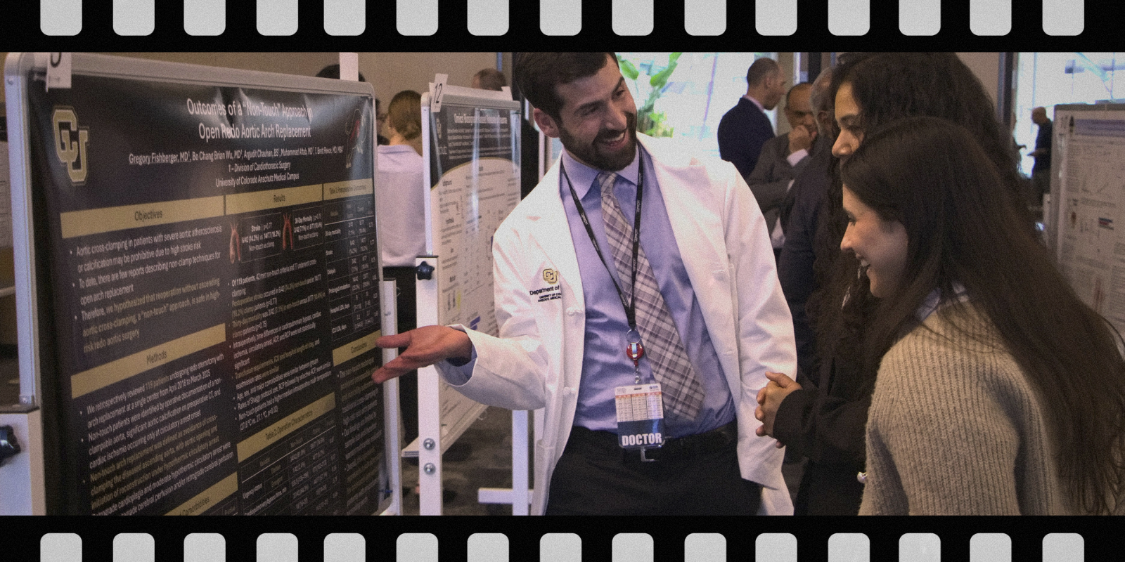 three people standing in front of a scientific poster conversing