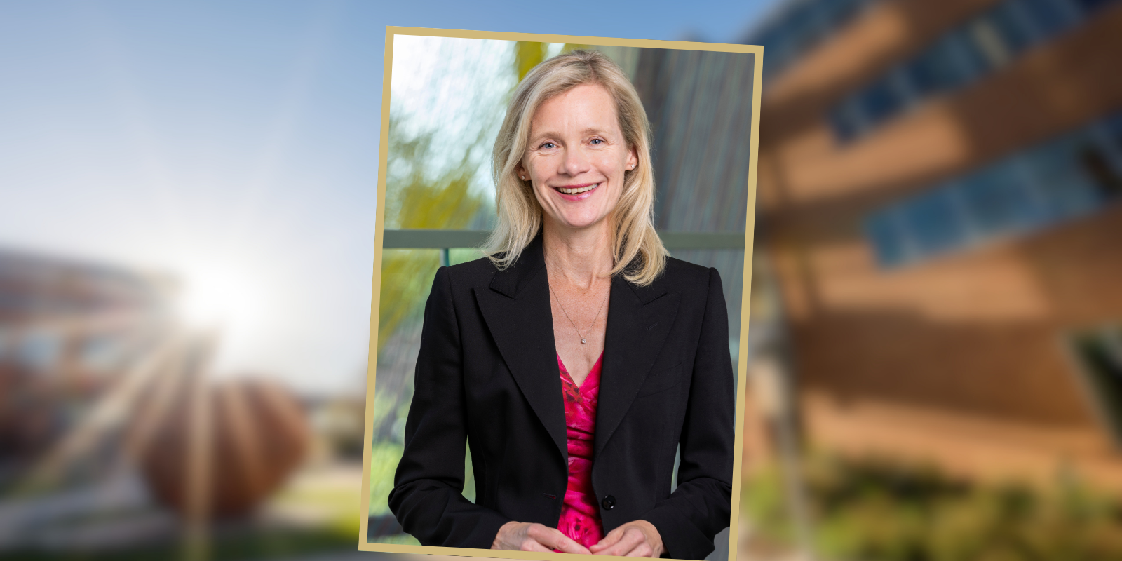 Portrait of Lotte Drybye, MD against a backdrop of campus. 
