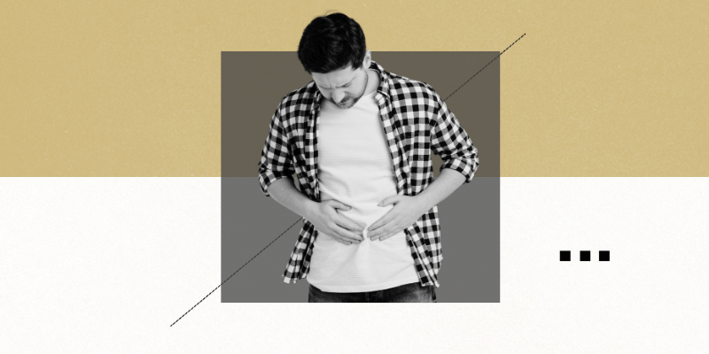 Image of man holding his stomach in hunger.