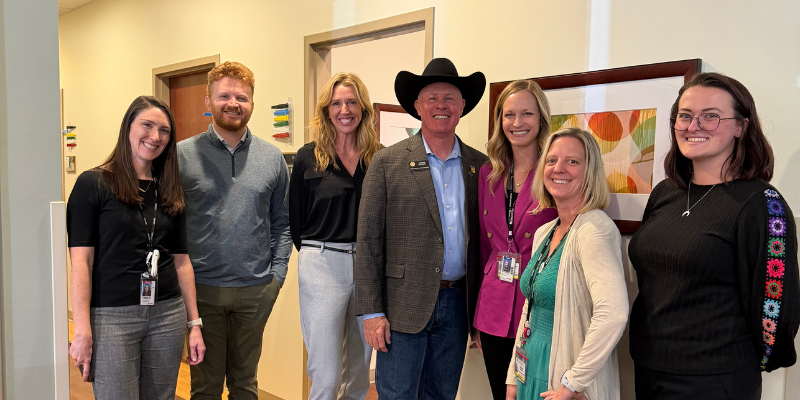 Grou photo of State Representative Anthony Hartsook and Lone Tree Primary Care staff and affilliates.