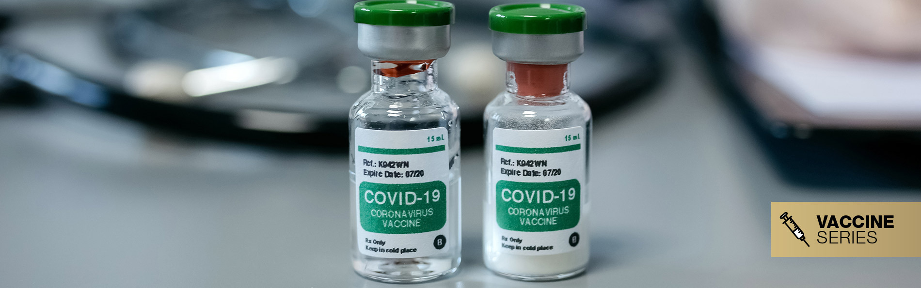 Two vaccine vials on doctor's desk