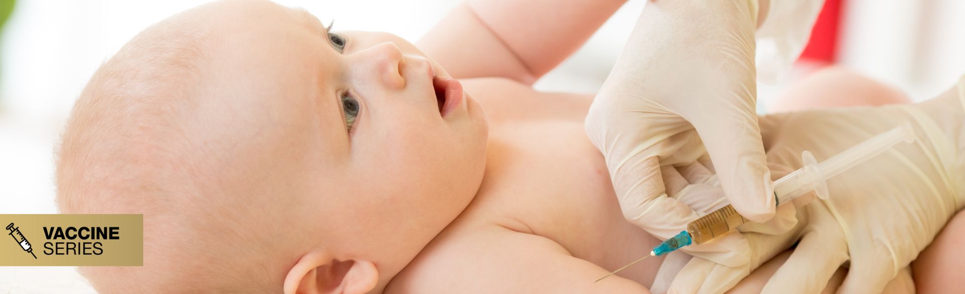 A baby getting a shot in the arm