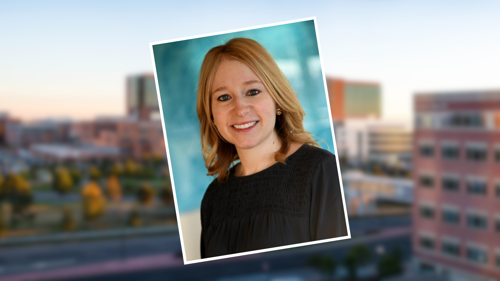 Elizabeth Kudron headshot in front of an image of Children's Hospital Colorado at the CU Anschutz Medical Campus