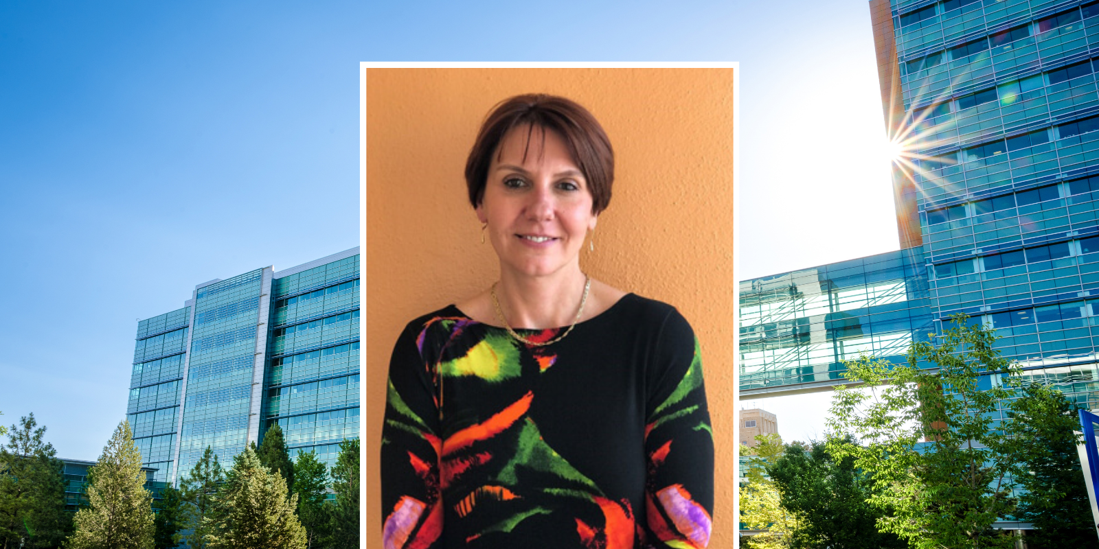 headshot of dana dabelea on anschutz campus background