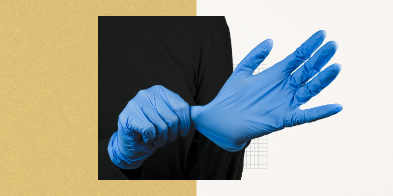 hands in surgical gloves