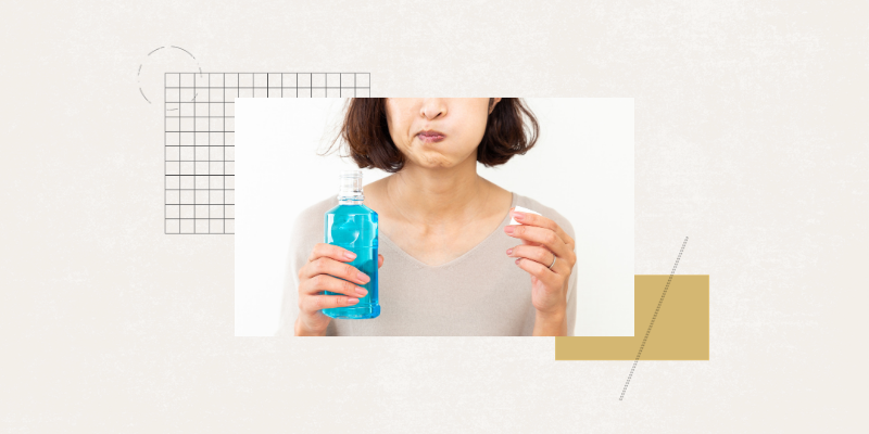 woman holding mouthwash bottle and cap