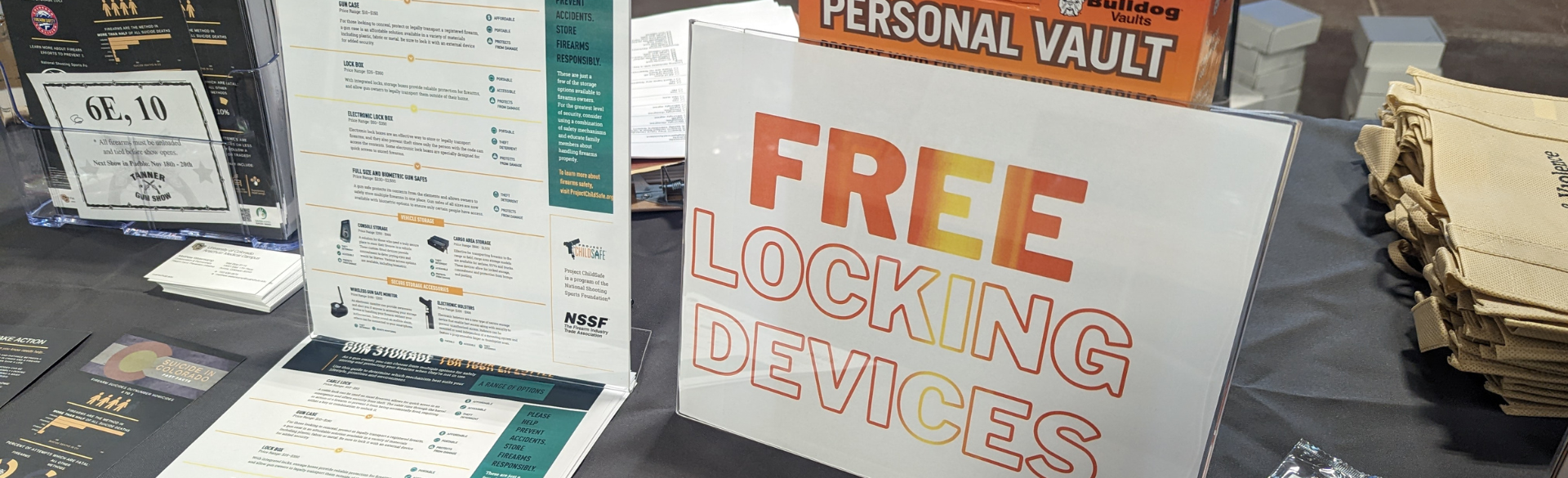 Sign on table at outreach event reading "Free locking devices"