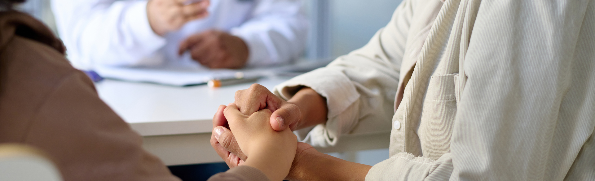 Navigator holding patient's hands