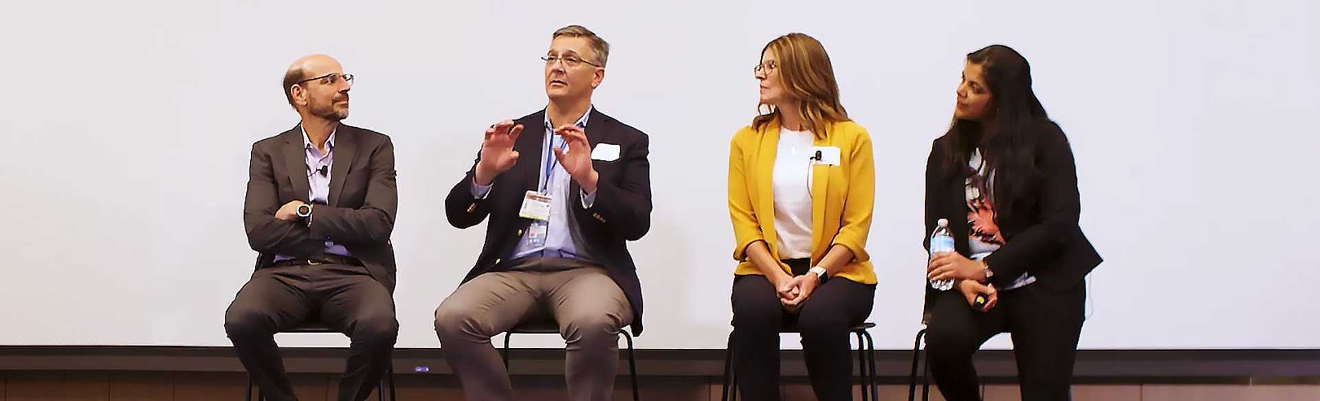 Panel on stage: Terry Fry, Michael Verneris, Amy Keating and Manali Kamdar